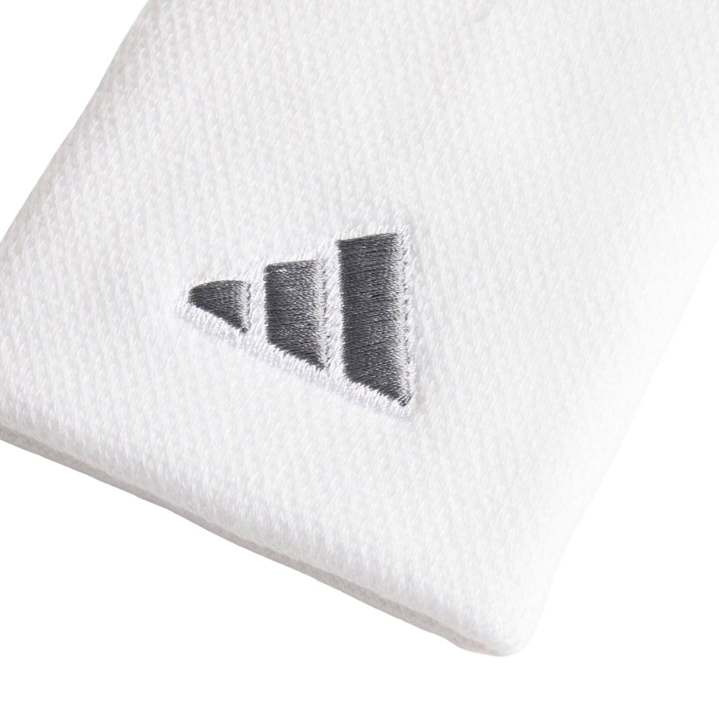 Adidas Large Tennis Wristband in white, close-up of the fabric texture and iron-metallic embroidered logo
